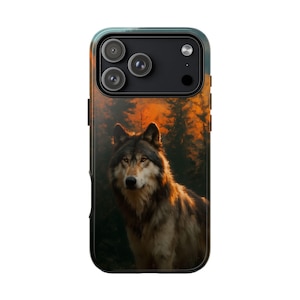 May include: A phone case featuring a detailed image of a wolf in a forest setting. The wolf is the focal point, with a backdrop of trees and a warm, orange-toned sky. The case has a black border.