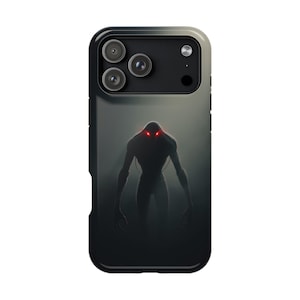 May include: A phone case featuring a dark, ominous design. The case has a black border and a gray gradient background. A silhouetted figure with glowing red eyes is centered on the case, creating a spooky aesthetic.