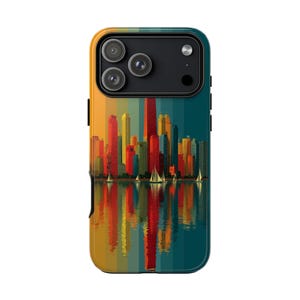 May include: A colorful phone case featuring a cityscape design. The artwork depicts a skyline with tall buildings in shades of red, yellow, and blue, reflected in the water below. Small sailboats dot the water. The case has a gradient background.