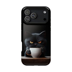 May include: Black phone case with a cartoon image of a black cat with yellow eyes, holding a white teacup. The cat has a stern expression. The phone case has a glossy finish and a dark background.