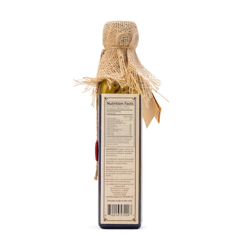 May include: A brown glass bottle with a burlap top and a label that says "Nutrition Facts" and "Ingredients". The bottle contains organic walnut oil. The label also says "Gluten Free, Vegan, Non GMO, Keep Refrigerated".