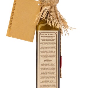 May include: A brown glass bottle with a hessian lid, filled with a golden liquid. The bottle label reads "Live Oil by Lesna" and describes the oil as "Amazingly Fresh Raw-Pressed Organic Oil Delightfully Hand-crafted, And Just The Way Mother Nature Intended!"