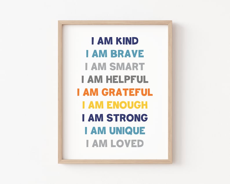 May include: A framed print with the text "I am kind, I am brave, I am smart, I am helpful, I am grateful, I am enough, I am strong, I am unique, I am loved." The text is in different colors, including blue, orange, yellow, and gray.