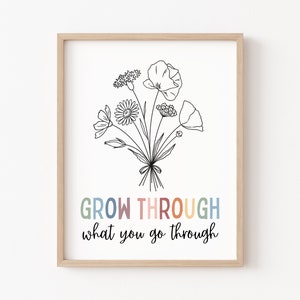 May include: A printable wall art print with a black and white line drawing of a bouquet of flowers. The text "GROW THROUGH what you go through" is written in rainbow colors below the flowers.