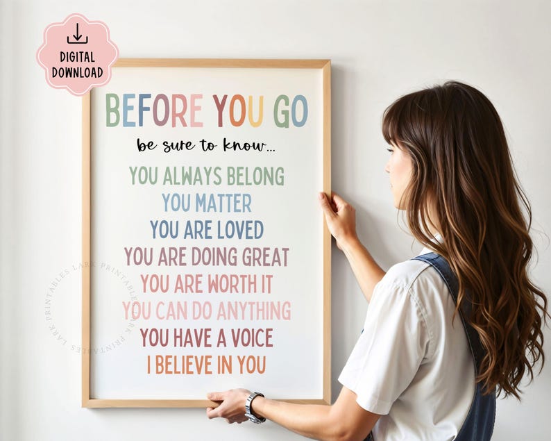 May include: A framed print with the words "BEFORE YOU GO" in colorful letters. The print includes the phrases "YOU ALWAYS BELONG", "YOU MATTER", "YOU ARE LOVED", and other positive affirmations. A digital download icon is in the upper left corner.