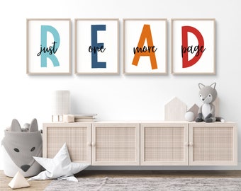 May include: Four framed prints spelling out the word "READ" in large colourful letters. The letters are in shades of blue, teal, orange, and red. The text "just one more page" is written in black script below the letters.