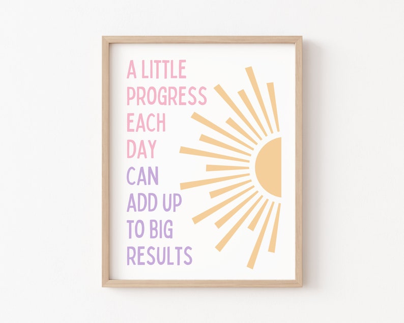 May include: A motivational quote in a light pink and purple font against a white background with a stylized sun graphic in orange. The quote reads "A little progress each day can add up to big results."