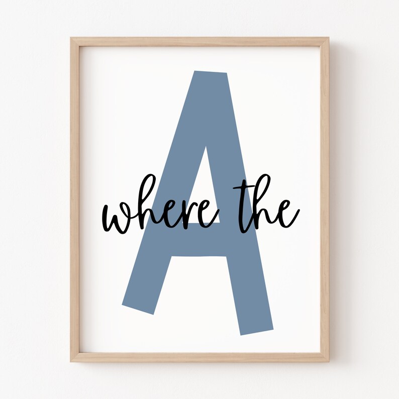 May include: A framed print featuring a large blue letter A and the text "where the" in black script.