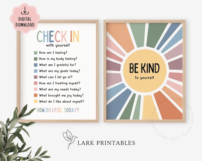 May include: Two framed prints with inspirational messages. One print says "CHECK IN with yourself" with a list of questions. The other print says "BE KIND to yourself" with a sunburst design. Both prints have a light wood frame.