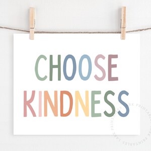 May include: A white printable poster with the text "CHOOSE KINDNESS" in rainbow colors. The letters are in a playful, hand-drawn style.