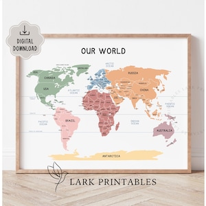 May include: A framed world map print with the text "OUR WORLD" at the top. The map is colour-coded, with each continent in a different colour. The print includes the text "DIGITAL DOWNLOAD" and "LARK PRINTABLES".