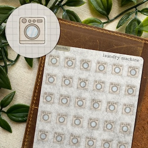 May include: A sheet of laundry machine stickers with a brown and beige color scheme. The stickers feature a washing machine design with a round window and buttons. The words "laundry machine" are printed on the sheet.