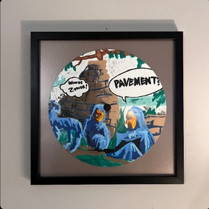 May include: A round, colorful illustration of three figures in blue hooded robes, with the text "Wowwee! Zowwee!" and "PAVEMENT?" in yellow speech bubbles. The background is a green, brown, and white landscape.