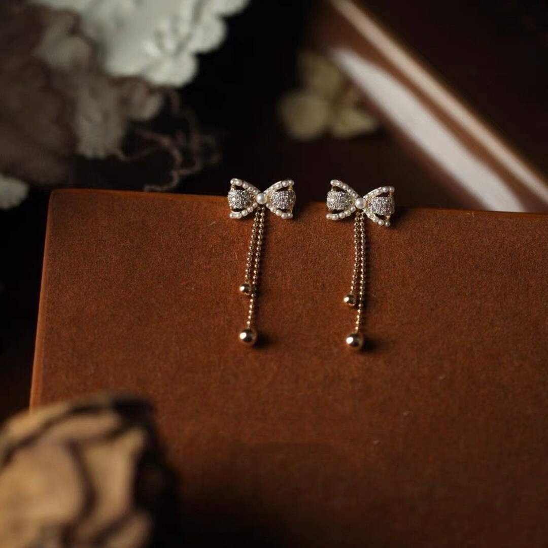 Vintage Pearl Bow Tie Earrings in 14K Gold Delicate Mother of Pearl