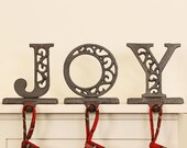 Set of 3 Cast Iron Christmas Stocking Holders Vintage Style Weighted quot JOY quot Mantelpiece Windowsill Christmas Stocking Hanger Hooks