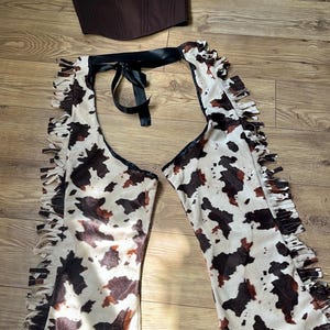 Multiple prints* cut out cowgirl chaps with fringing and ribbon belt