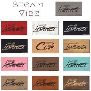 May include: A collection of laserable leatherette samples in various colors, including red, black, white marble, pink, teal, and brown. Each sample displays the "Laserable Leatherette" logo. The image also features the text "STEAM V!BE".