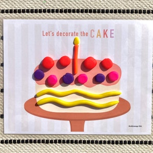 May include: A printable activity sheet with the text "Let's decorate the CAKE" and a picture of a cake with a candle and colorful decorations.