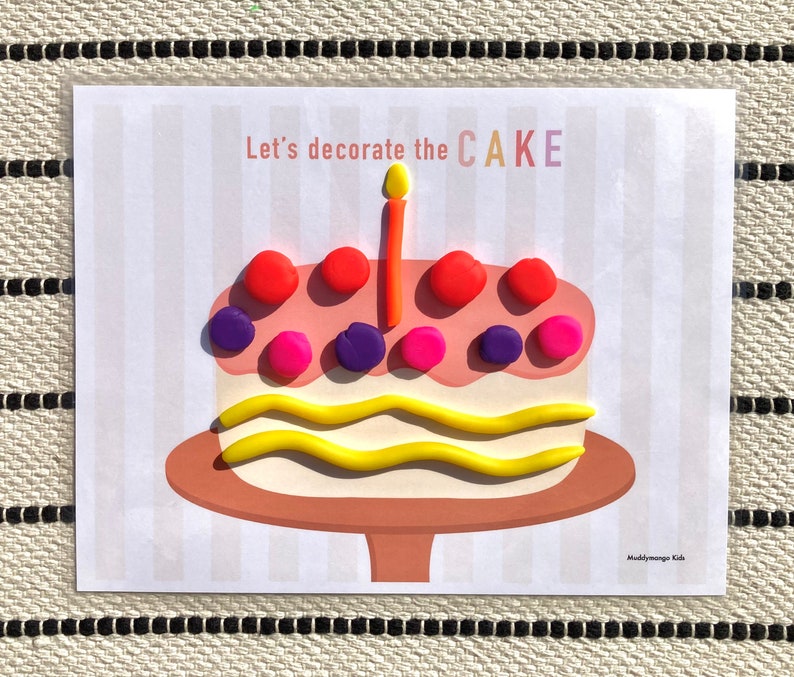 May include: A printable activity sheet with the text "Let's decorate the CAKE" and a picture of a cake with a candle and colorful decorations.