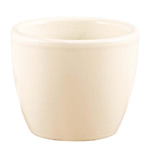 May include: A white ceramic egg cup with a smooth, rounded shape.