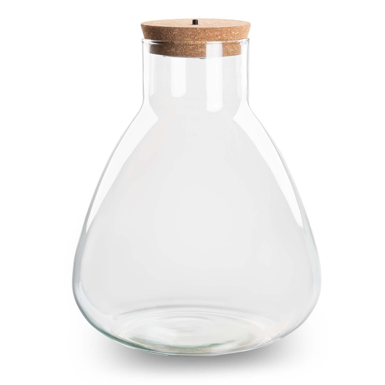 May include: A clear glass bottle with a cork stopper. The bottle is shaped like a teardrop and has a wide base.