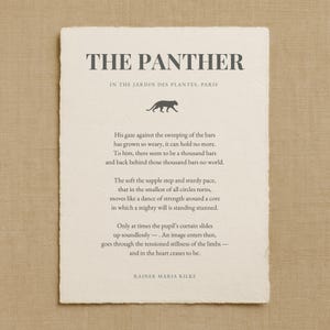 May include: An off-white print with the poem "The Panther" by Rainer Maria Rilke. The title and author's name are in a dark grey font. A silhouette of a panther is above the poem's text, set in the Jardin des Plantes, Paris.