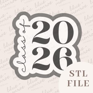 May include: A cookie cutter in the shape of a graduation cap with the text "Class of 2026" in a script font. The numbers "2026" are in a bold, sans-serif font. The words "STL FILE" are in a sans-serif font.