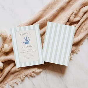 May include: Two rectangular birthday invitation cards featuring a light sage green and white vertical striped pattern. The front card displays a blue handprint graphic, the text "Officially a handful", and details for Oliver's 5th birthday.