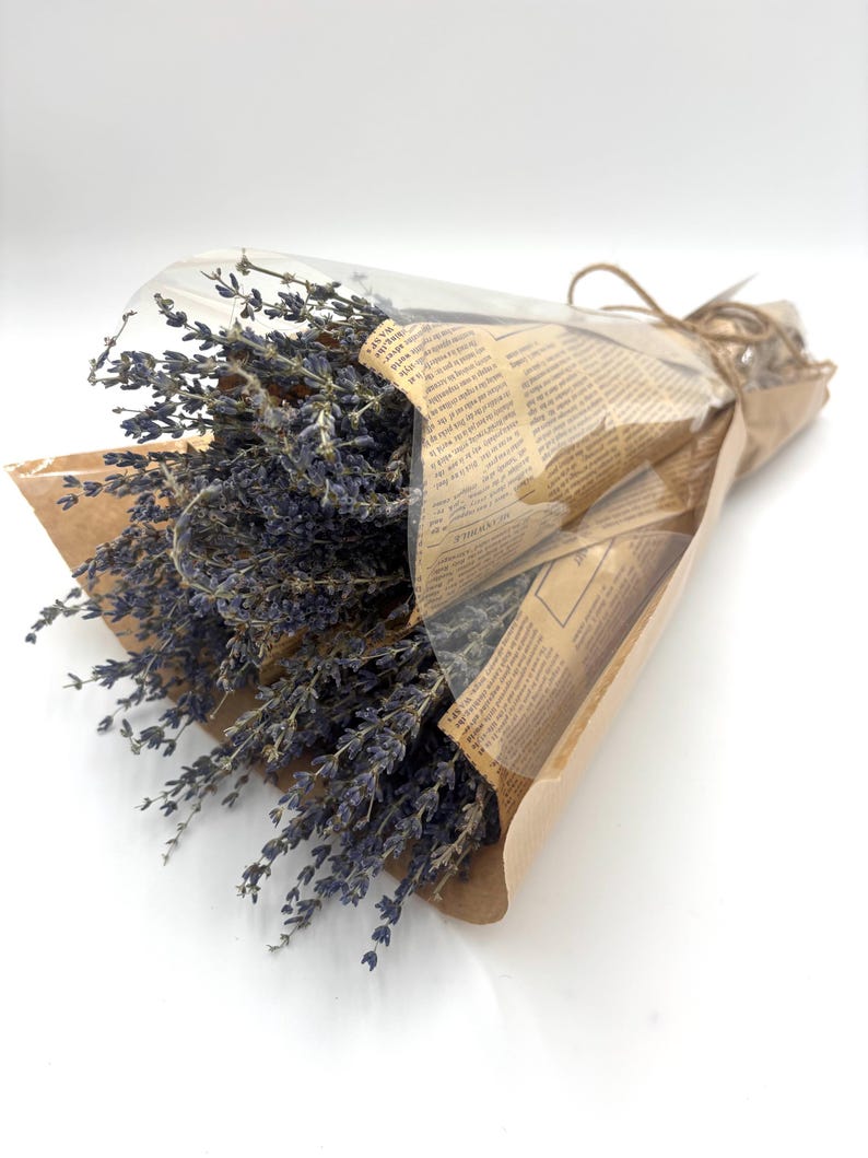 May include: A bouquet of dried lavender flowers wrapped in brown paper and tied with twine.