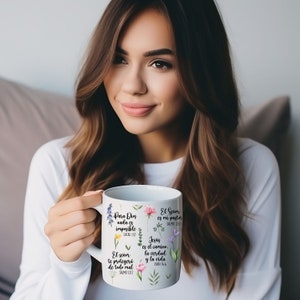 May include: White ceramic mug with floral designs and inspirational quotes in Spanish. The quotes include "Para Dios nada es imposible", "El Se&ntilde;or es mi pastor", "Jes&uacute;s es el camino, la verdad y la vida", and "El Se&ntilde;or te proteger&aacute; de todo mal".