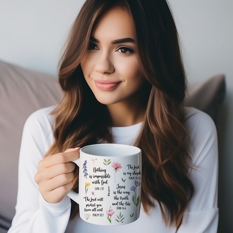 May include: White ceramic mug with floral designs and inspirational bible verses. The mug reads "Nothing is impossible with God", "The Lord is my shepherd", "Jesus is the way, the truth, and the life".