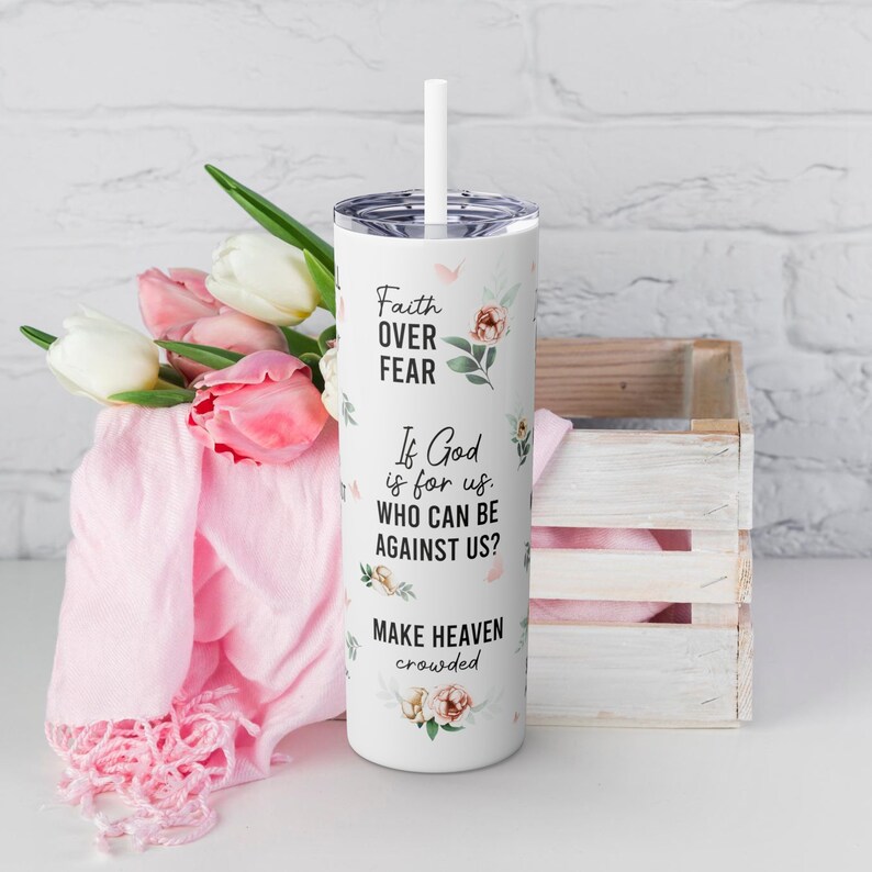 May include: White tumbler with a floral design and the text "Faith Over Fear", "If God is for us. Who can be against us?" and "Make Heaven crowded".