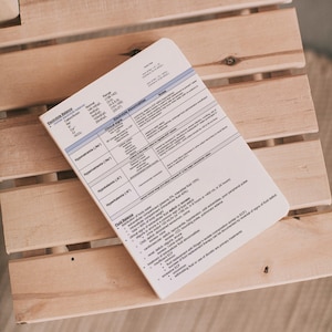 May include: A white sheet of paper with a blue heading "Electrolyte Abnormalities" and a table listing electrolyte abnormalities, their clinical signs, and treatment. The table includes information on hyponatremia, hypernatremia, hypokalemia, and hyperkalemia.