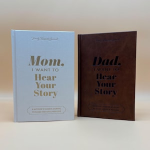 May include: Two hardcover journals, one light blue and one brown, with gold lettering. The light blue journal reads "Mom, I WANT TO Hear Your Story." The brown journal reads "Dad, I WANT TO Hear Your Story." Both are "A Mother's/Father's Guided Journal to Share Her/His Life & Her/His Love."