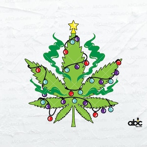 May include: A green cannabis leaf decorated as a Christmas tree with colourful baubles, a gold star, and green smoke-like accents. The design includes a string of lights and the text "ABCLabCrafts".