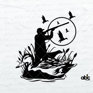 May include: Black silhouette of a duck hunter aiming a shotgun at flying ducks. The design includes a duck in the water, cattails, and a circular frame. The image is a graphic design for hunting enthusiasts.