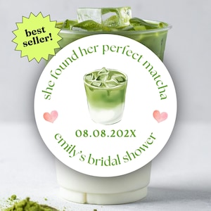 May include: A round white sticker featuring a green illustration of an iced matcha latte, two small pink hearts, and the text: she found her perfect matcha, 08.08.202X, and emily's bridal shower. A yellow starburst icon reads best seller.