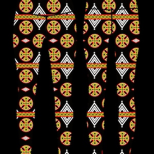 May include: Black leggings with a repeating pattern of yellow, red, and white geometric shapes. The pattern includes circles, diamonds, and crosses.