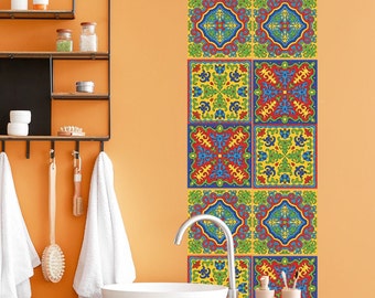May include: A bathroom with an orange wall and a white sink. A decorative tile border with colorful geometric patterns is on the wall. The tiles are in shades of red, blue, green, and yellow.