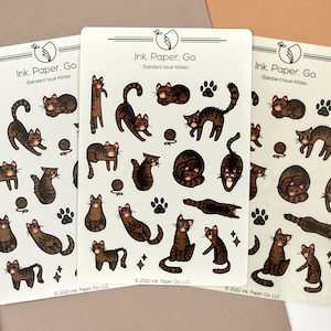 Standard Issue Kitties Kiss Cut Sticker Sheet | cute tabby cat stickers, brown tabby cat, grey tabby cat, mackerel tabby cat stickers