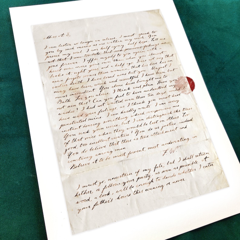 May include: A handwritten letter on aged paper with a red wax seal. The letter is written in cursive script and expresses deep affection and longing. The text reads, "I can listen no longer in silence. I must speak to you by such means as are within my reach. Tell me not that I am too late, that my precious feelings are gone forever. I offer myself to you again with a heart even more your own than when you broke it, eight years and a half ago. Bars at say that man forgets..."