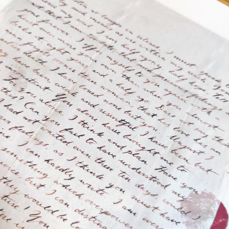 May include: A close-up of a handwritten letter with brown ink on cream-colored paper. The letter is written in a cursive script and the text reads, "I must speak to you again with a heart even more your own than when you almost forgot death. I have loved none but you. Unjust I have been, weak and resentful I have been but sooner than woman, that his love has an inconstant. You alone have brought me to this? Can you fail to have understood my feelings, as I think you must have. I can hardly write. I am ever something which overpower me, but I can distinguish they would be lost. You"