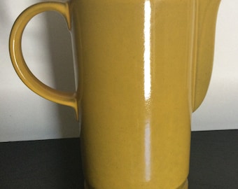 Vintage “Ceramano West Germany” 7 1/4” Tall Mustard Colored Ceramic Pitcher.