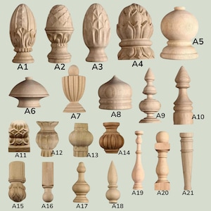 May include: A collection of twenty-one unfinished light-colored wooden finials and furniture legs labeled A1 through A21. The items feature various carved shapes including spheres, points, and decorative floral patterns for woodworking projects.