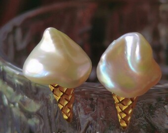 May include: A pair of pearl earrings shaped like ice cream cones with gold-coloured waffle cone details.