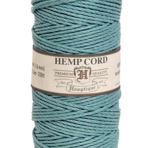 May include: A spool of teal blue hemp cord, labeled "Hemp Cord" with the brand name "Hemptique" and the text "Premium Quality" and "Est. 1997".