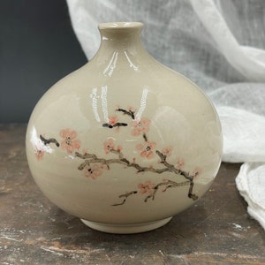 Mini moon vase with cherry blossom decor. Hand painted ceramic. Unique and beautiful.