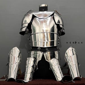 May include: A full suit of silver armor with a breastplate, pauldrons, and greaves. The armor is displayed on a mannequin against a gray background. The text "HEBEAK" is visible in the image.