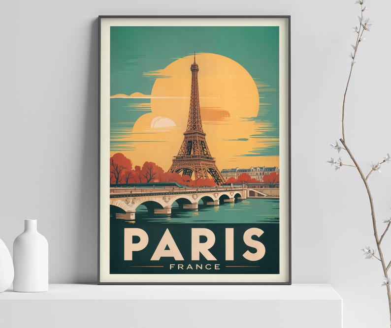 May include: A framed travel poster depicting the Eiffel Tower in Paris, France. The artwork has a vintage aesthetic, with a large yellow sun in the background. The word "PARIS" is displayed in bold letters, with "FRANCE" underneath.