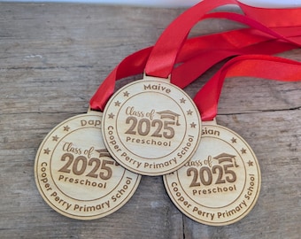 Personalised preschool graduation wooden medals. Wooden custom nursery graduation medals that can include any wording and name.